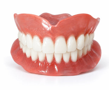 Affordable custom ThermoPlas flexible full arch denture available online.