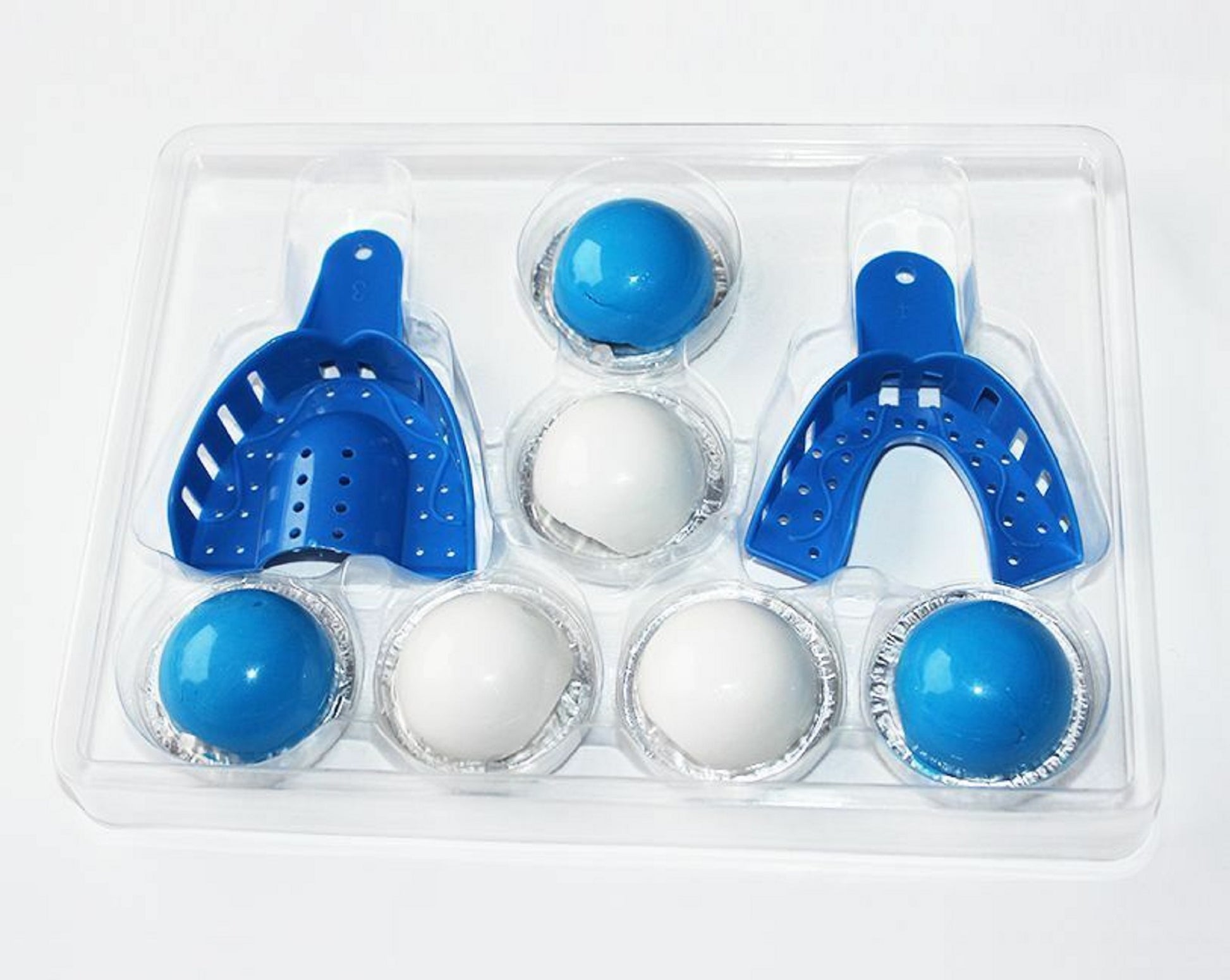 Set of blue and white mouthguards in a clear plastic packaging on a white background